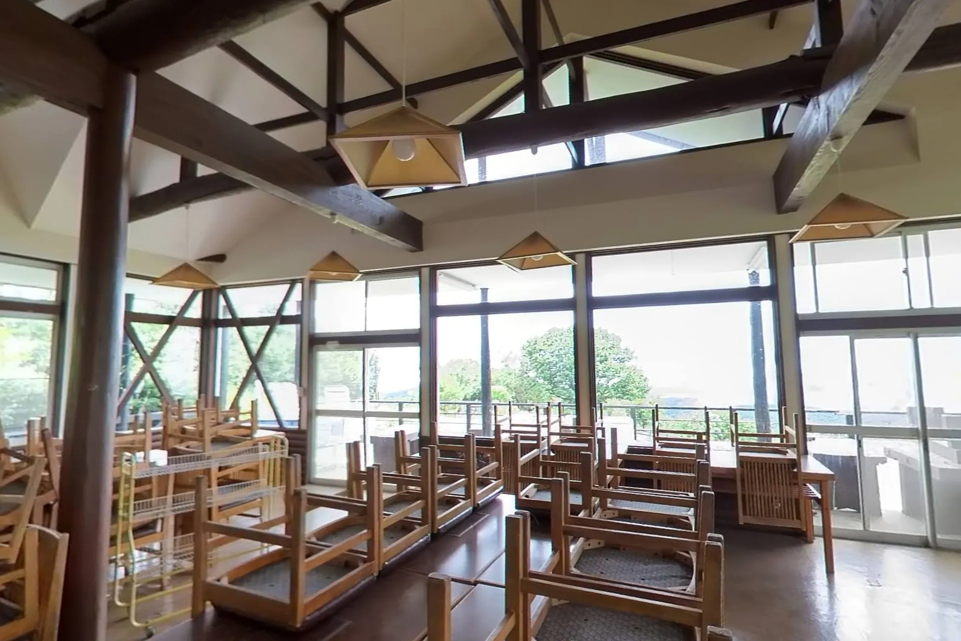360° — the hall as we found it, August 2025: chairs stacked on the tables, the view still in the windows